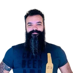 Portrait of a man with a long dark beard wearing a navy graphic T-shirt